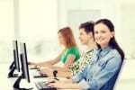 smiling female student at computer