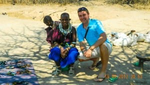 Liam in a Masai village