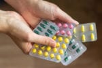Weekly News Summary Someone holding packets of medication to symbolise antidepressants