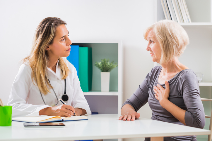 A doctor checks patient for heart disease